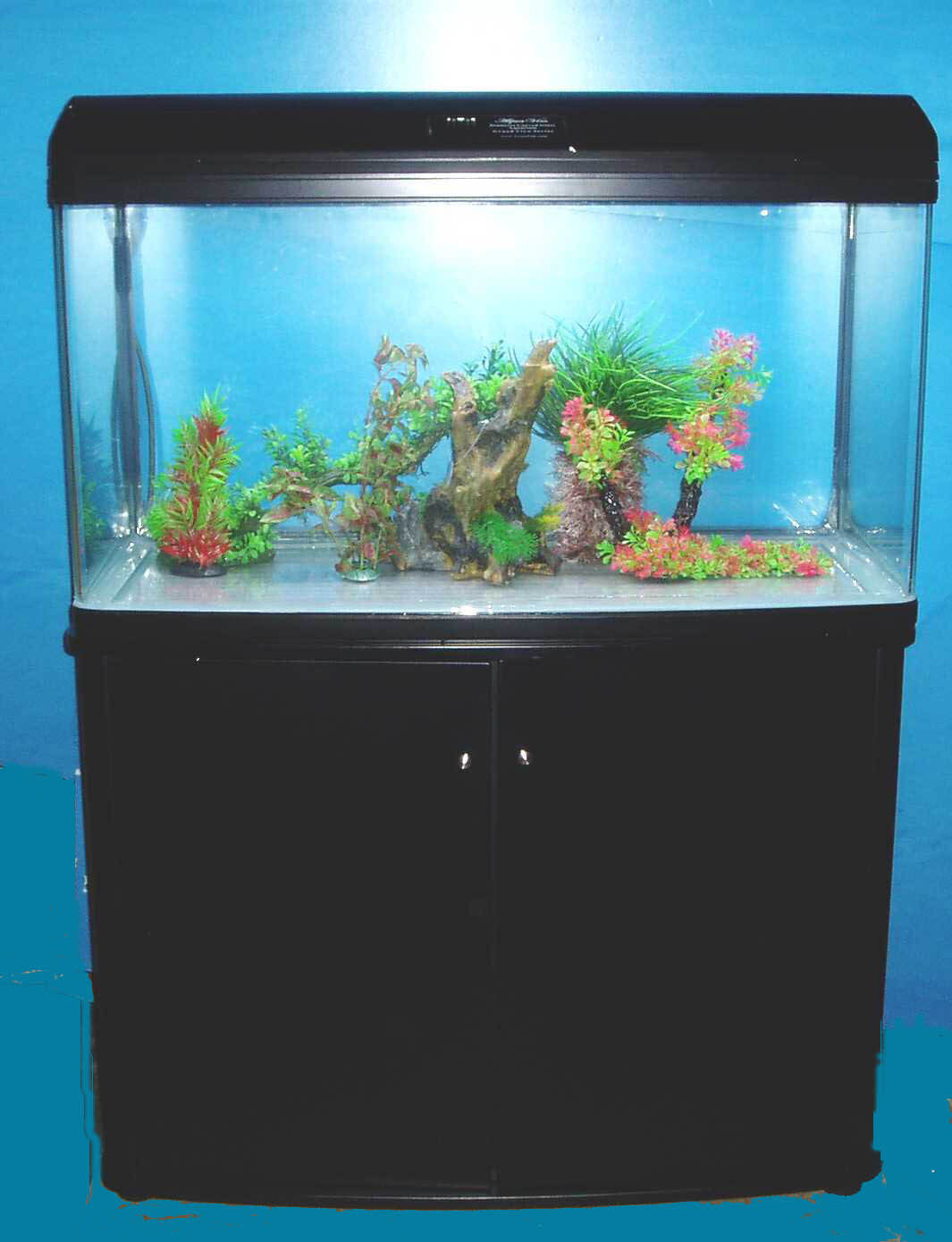 63 gal seamless bow glass aquarium with wood stand/light hood/filter, fish ready